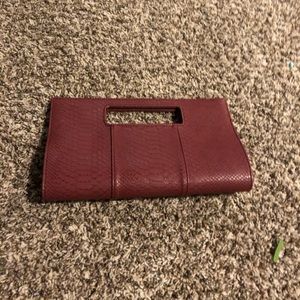 Purple faux-alligator skin magnetic hand held bag